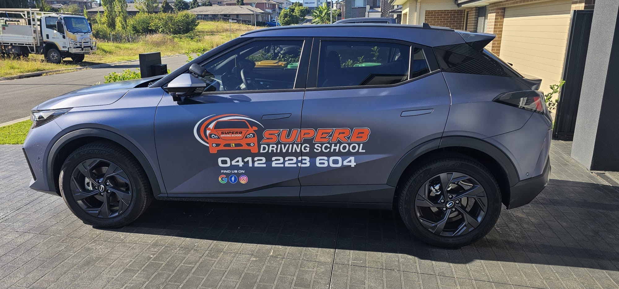 Superb Driving School — branded dual-control vehicle